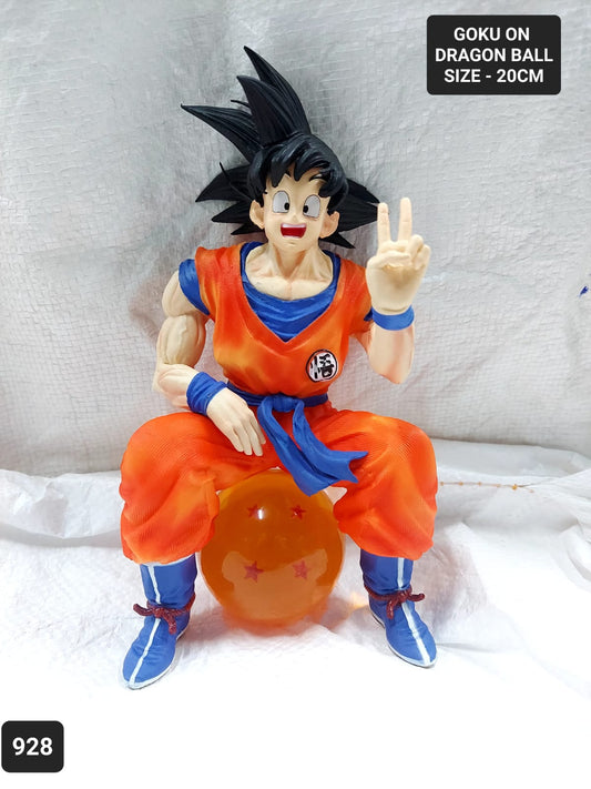 DBZ Goku sitting on a Dragon ball action figure